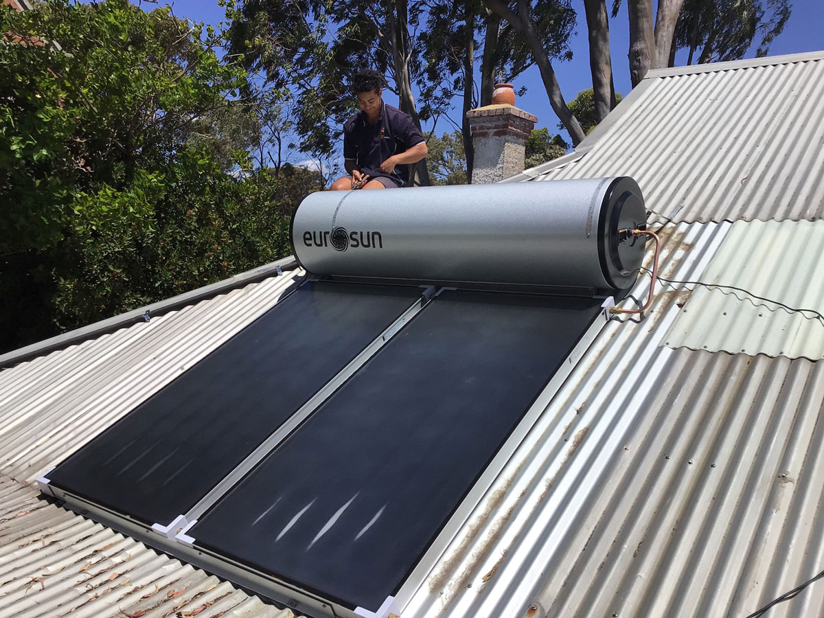 Enphase Solar Battery Repairs in Perth 2 Solar Repairs technician working on a rooftop system in Perth
