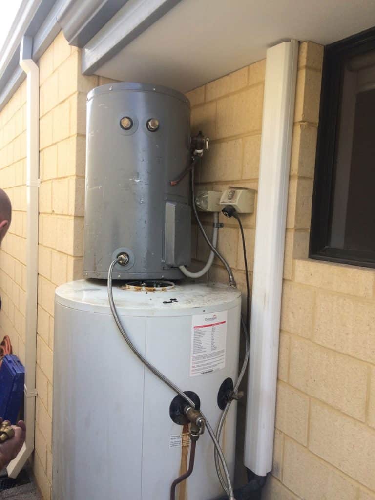 Solar Hot Water 22 Ground-mounted solar hot water system installed outdoors. Energy-efficient water heating solution for homes.